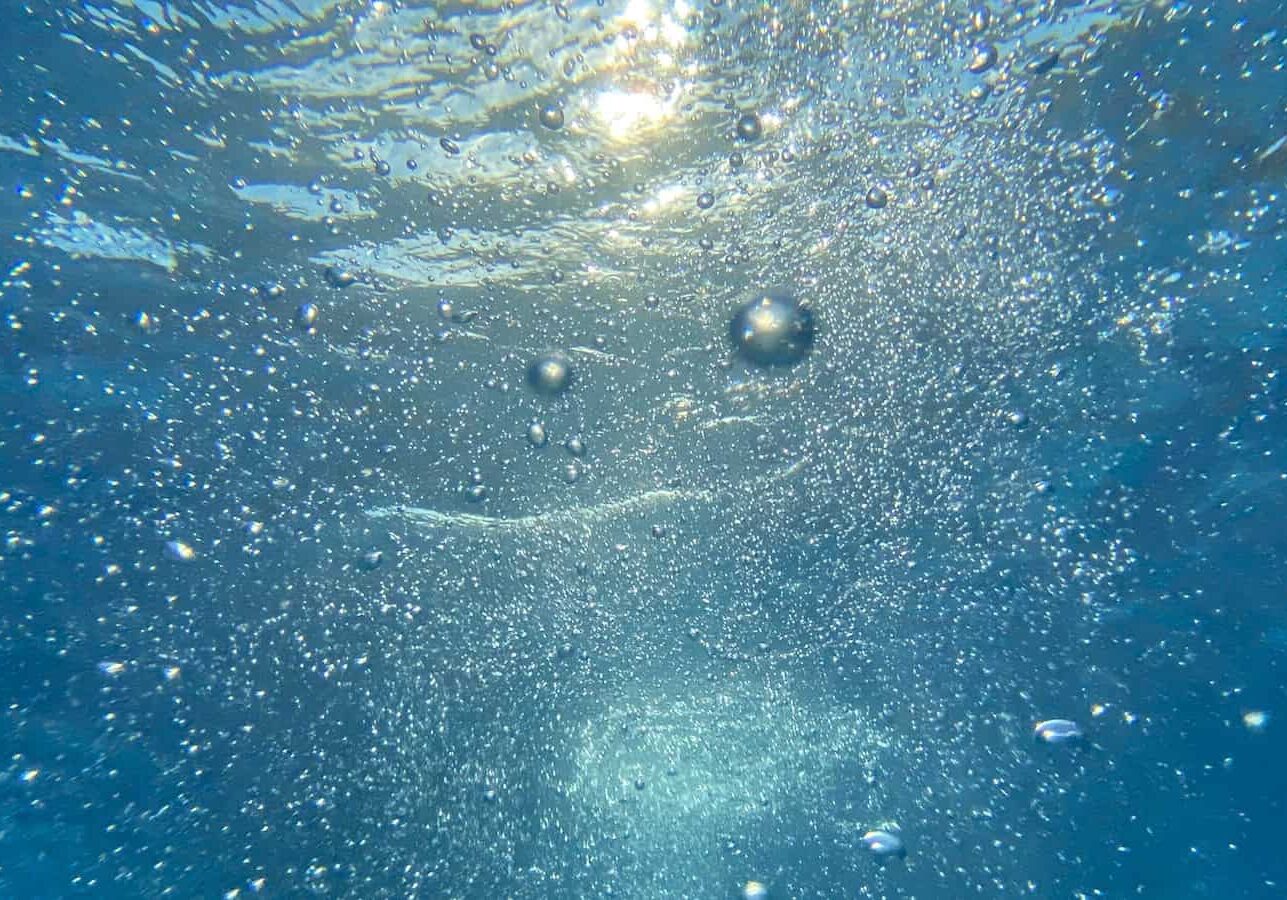 Photo by J K water bubbles in blue water